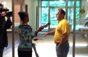 Fox-2 TV reporter Ingrid Kelley questioned Mike Mitchell in Plymouth Township Hall, July 2015